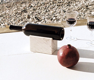 wine holder at the sea coast - glass of wine and magrana wine holder at the sea coast - glass of wine and magrana